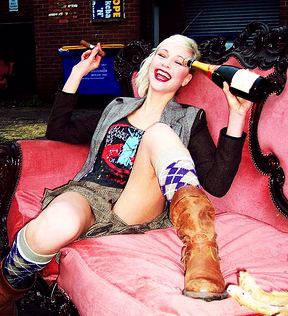 Chavette girl posing with cigar and champagne